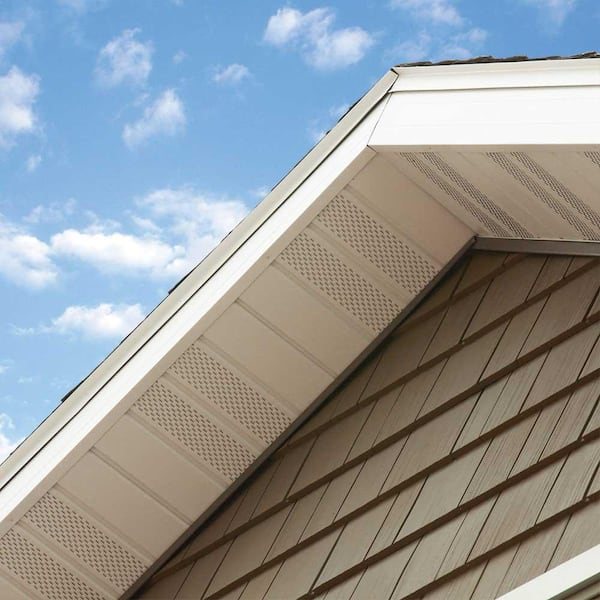 Perforated light soffit panels beneath a roof edge